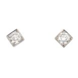 A pair of brilliant-cut diamond stud earrings. Each designed as a brilliant-cut diamond, with