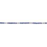 An 18ct gold diamond and sapphire bracelet. The circular-shape sapphire line, with brilliant-cut