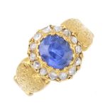 A late Victorian gold, Ceylon sapphire and diamond ring. The oval-shape sapphire, with rose-cut