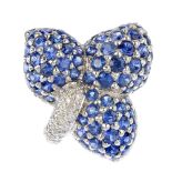 A sapphire and diamond dress ring. Of floral design, comprising three pave-set sapphire petals, with