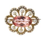 An Edwardian 15ct gold tourmaline, pearl and split pearl cluster brooch. The oval-shape pink
