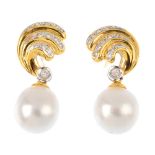 A pair of 18ct gold cultured pearl and diamond earrings. Each designed as a cultured pearl drop,