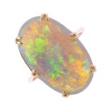 An opal single-stone ring. The oval opal cabochon, with tapered shoulders. Estimated dimensions of