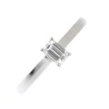 A platinum diamond single-stone ring. The rectangular-shape diamond, with plain band. Estimated