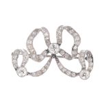 A diamond bow brooch. The ribbon set throughout with old-cut diamonds and a similarly-cut diamond