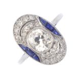 A diamond and sapphire dress ring. Of oval outline, the old-cut diamond collet, with single-cut