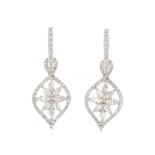 A pair of diamond earrings. Each designed as a marquise-shape cluster, with brilliant-cut surround