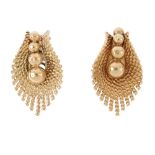 A pair of 1960s earrings. Each designed as a graduated bead line, within a stylised fan surround.