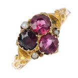 A mid Victorian 15ct gold garnet and split pearl ring. Designed as a circular-shape garnet