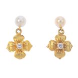 A pair of cultured pearl and diamond floral earrings. Each designed as a brilliant-cut diamond and