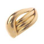 An Edwardian 18ct gold snake ring.Designed as a coiled snake, with grooved detail. Hallmarks for