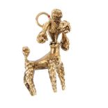 A dog charm. The stylised poodle, with articulated head and surmount loop. Length 3.1cms. Weight 8.