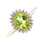 A 9ct gold peridot and diamond cluster ring. The oval-shape peridot, with single-cut diamond