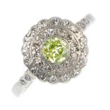 An early 20th century platinum and 18ct gold diamond and 'coloured diamond' cluster ring. The