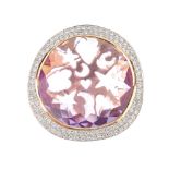 An 18ct gold diamond and amethyst pendant. The circular-shape amethyst, with brilliant-cut diamond