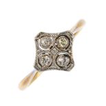 An early 20th century 18ct gold and platinum diamond quatrefoil ring. The single-cut diamond