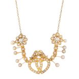 An early 20th century gold split pearl necklace. The split pearl bow and interwoven hearts, with