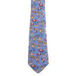 HERMÈS - a silk tie. Featuring a Hawaiian theme with hula dancers, palm trees and shells on a blue