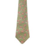 HERMÈS - a silk tie. A green coloured tie featuring playful pink elephants. Length measures