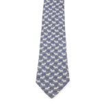 HERMÈS - a silk tie. A blue coloured tie with zebra print pattern. Length measures 149cms. Tie is in