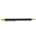 CARTIER - a Must De Cartier ballpoint pen. Designed with a black lacquered body and gold-tone clip