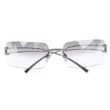 CHANEL - a pair of rimless sunglasses. Featuring rectangular lenses with a grey gradient, brushed