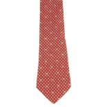 HERMÈS - a silk tie. Featuring a nesting chicken and egg motif on a red background. Length