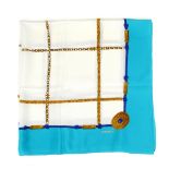 CHANEL - a silk scarf. Designed with a central woven chain motif, edged with a pattern of blue