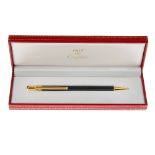 CARTIER - a Must De Cartier Trinity ballpoint pen. With a black resin body, gold-tone clip,