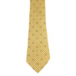 HERMÈS - a silk tie. Featuring a nesting chicken and egg motif on a butter yellow background. Length