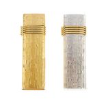 CHRISTIAN DIOR - two lighters. Both of the same design with the maker's initials embossed throughout