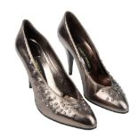 CHARLES JOURDAN - a pair of court shoes. Crafted from metallic silver leather adorned with paste