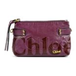 CHLOÉ - a two-way pouch handbag. Featuring a glazed purple leather exterior with maker's name