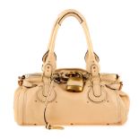 CHLOÉ - a beige Paddington handbag. Featuring a beige leather exterior, dual rolled leather handles,