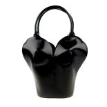 ISSEY MIYAKE - a rare 1990s shaped leather Bustier handbag. An example of this bag can be found in