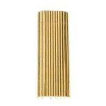 CARTIER - a lighter. Designed with a ribbed gold-tone exterior. Measuring 1 by 2.2 by 6.7cms. With