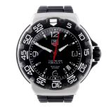 TAG HEUER - a gentleman's Formula 1 wrist watch. Stainless steel case with calibrated bezel.