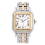 CARTIER - a Panthere bracelet watch. Stainless steel case with yellow metal bezel. Reference 1100,
