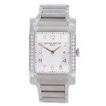 BAUME & MERCIER - a lady's Hampton bracelet watch. Factory diamond set stainless steel case.