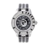 DIOR - a lady's Christal bracelet watch. Stainless steel case with factory diamond set bezel.