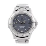 TAG HEUER - a gentleman's 4000 Series bracelet watch. Stainless steel case with calibrated bezel.