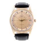 UNIVERSAL GENÈVE - a gentleman's Polerouter Date wrist watch. Rose gold plated case with stainless