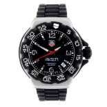 TAG HEUER - a mid-size Formula 1 wrist watch. Stainless steel case with calibrated bezel.