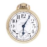 An open face railroad grade pocket watch by Waltham. Gold filled case. Numbered 9871695. Signed