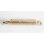 A 9ct gold Samson & Mordan cigar piercer, the outer case with engine turned decoration and