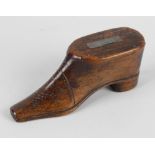 A 19th century treen novelty snuffbox modelled as a shoe with sliding lid, with applied white