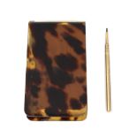 A miniature notepad and pencil, the notepad with tortoiseshell casing and 15ct gold mount and