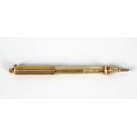 A Sampson Mordan & Co. 15ct gold retractable pencil, of cylindrical form having ribbed outer case