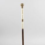 A late 19th century lady's carved ivory handled walking cane, the carved textured handle with