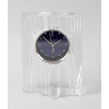 A modern French Daum (Nancy) lead crystal glass mantel clock. The shaped rectangular case with